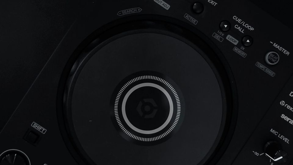 Top-down view of a Pioneer DDJ-FLX4 DJ controller on a black surface