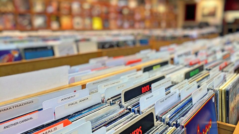 Racks of second hand vinyl records in an independent record shop, ready for digging