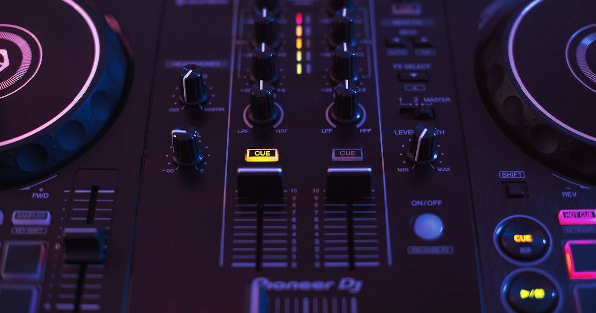 DJ hands on a Pioneer mixer preparing to record a set