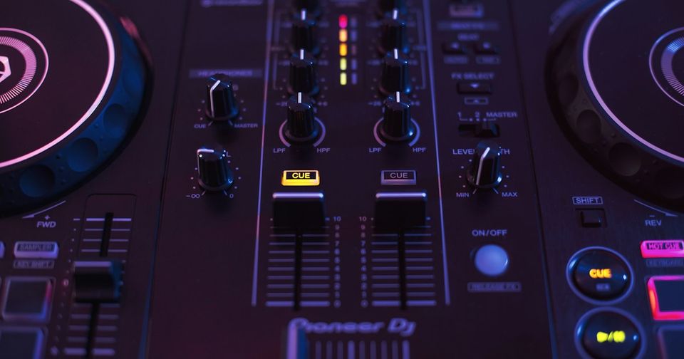 DJ hands on a Pioneer mixer preparing to record a set