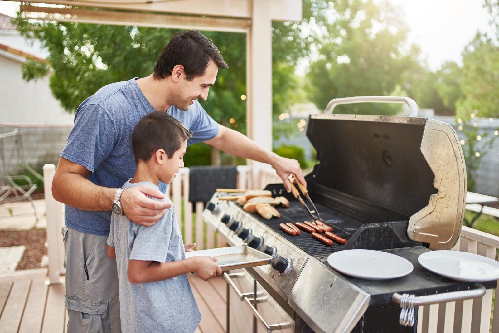 father and son grilling