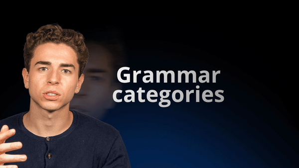 flowexam.com teacher explaining in English grammar categories on a blackboard with examples for TOEIC® preparation