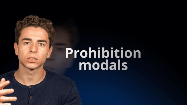 flowexam.com teacher explaining prohibition modals with examples on a blackboard for TOEIC® preparation