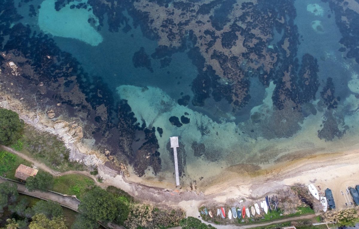 Aerial view of Canebiers bay's wooden pontoon in Saint-Tropez taken by drone