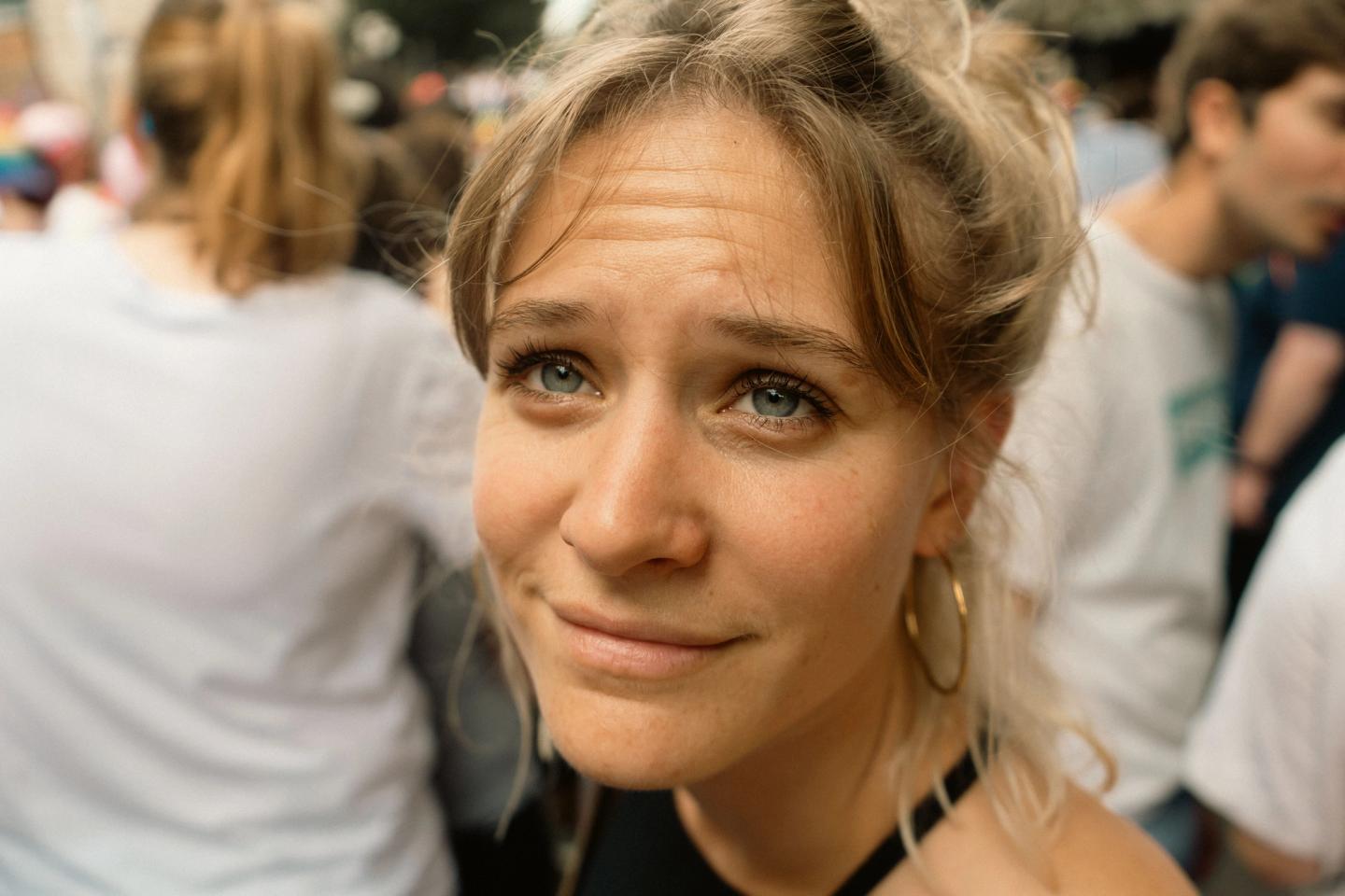A woman in the Pride crowd