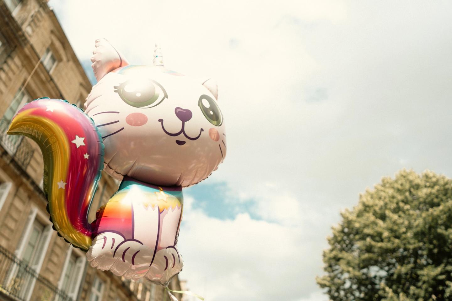 A large rainbow cat-shaped helium balloon