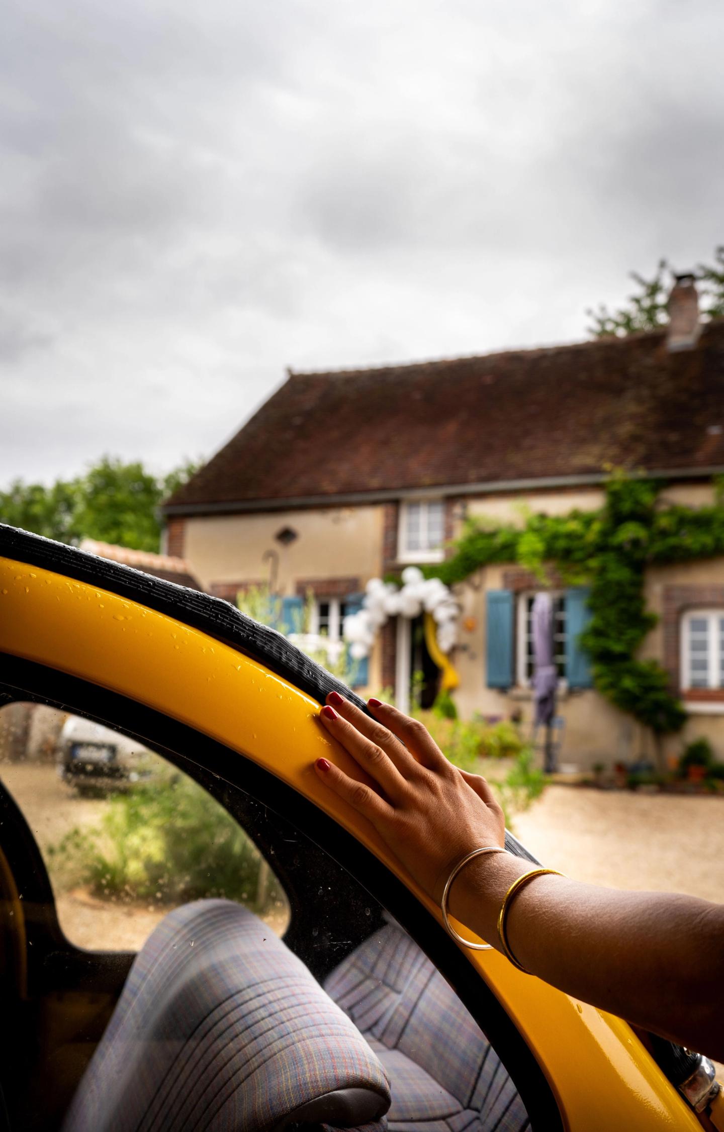 A hand on an old car