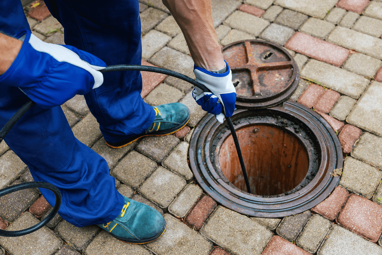 Plumber doing hydro jetting on sewer