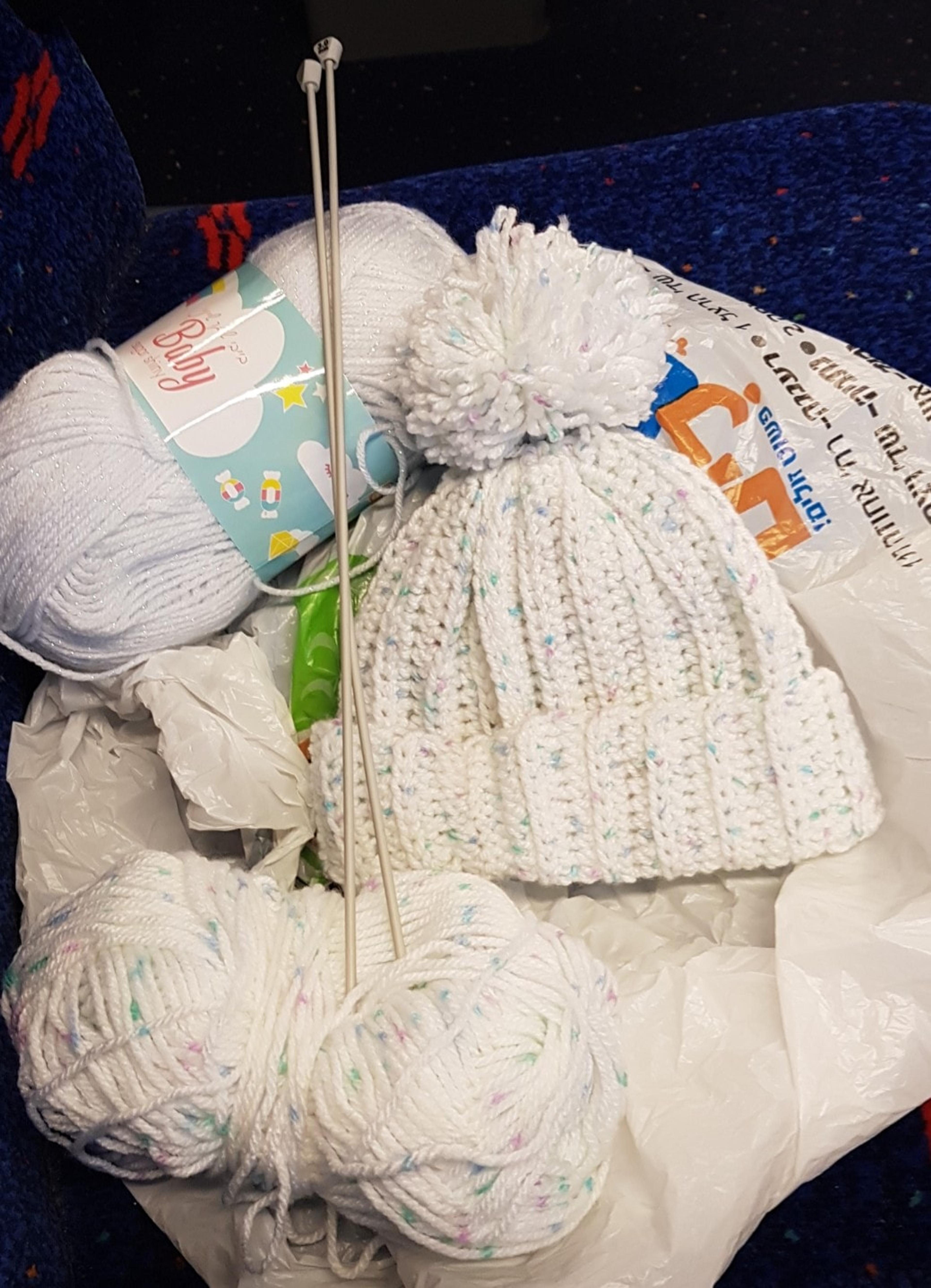 White baby hat with pompom