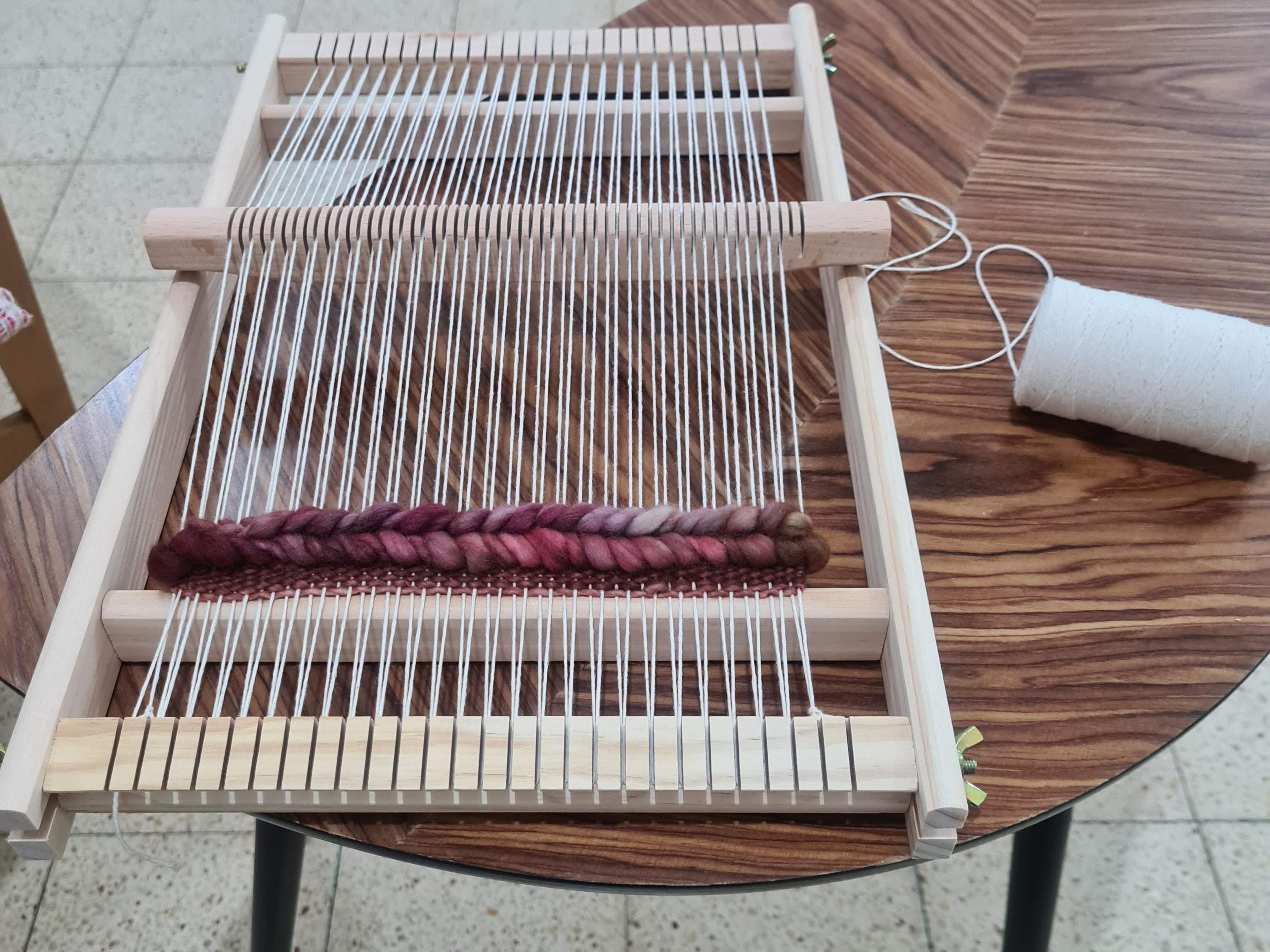 Weaving in a loom work in progress