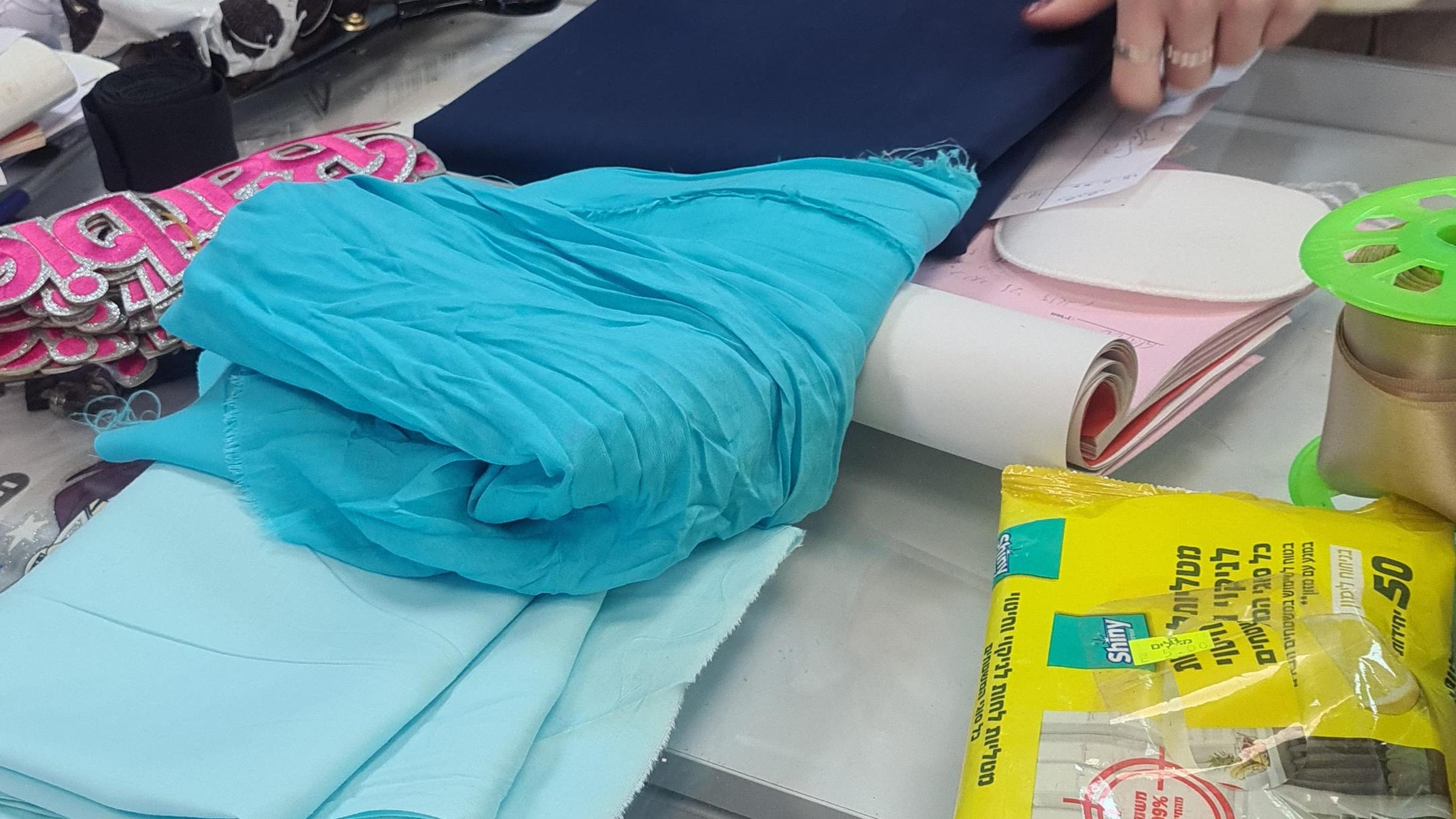 buying cloth in 3 shades of blue for the skirt