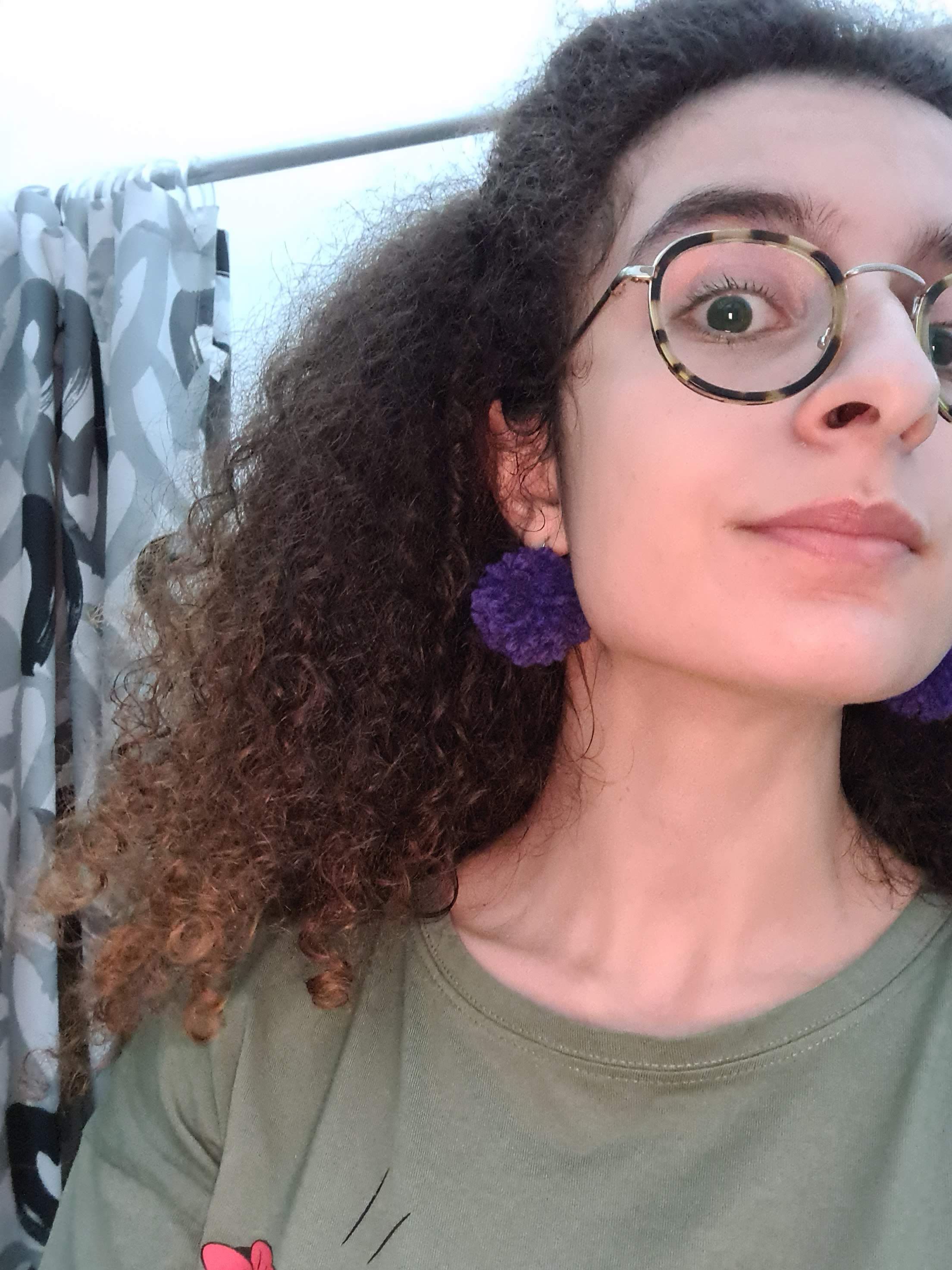 Mirabel's purple pompom earrings