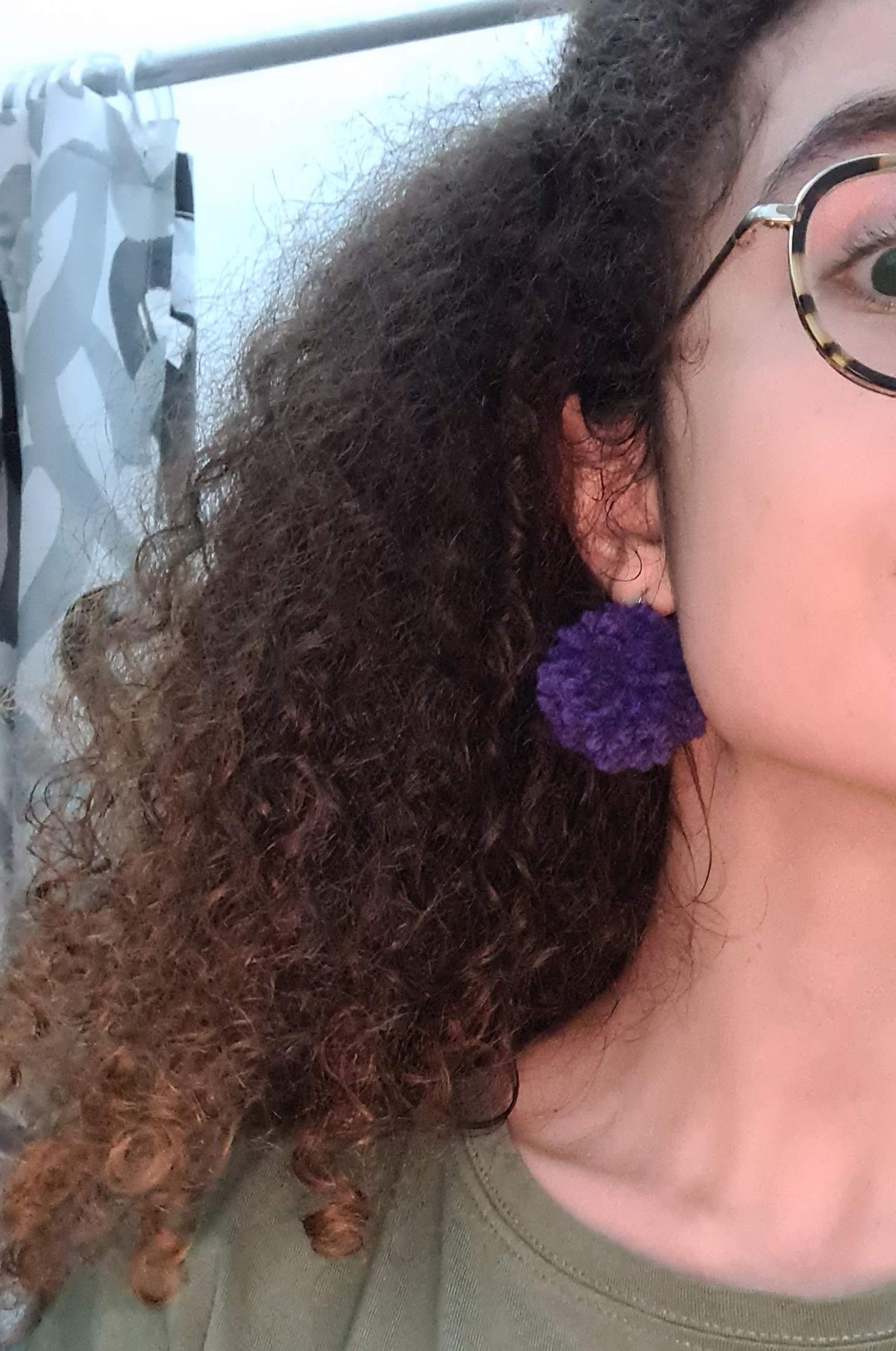 Mirabel's purple pompom earrings