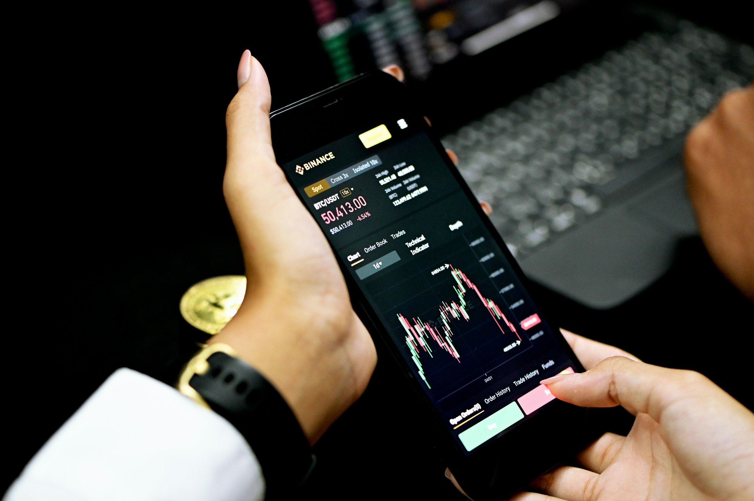Person Holding Phone - Crypto Trading Tips