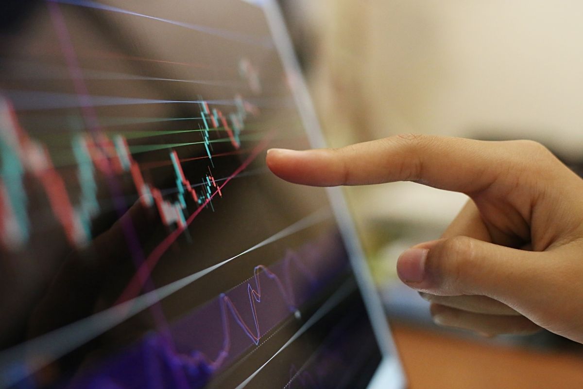 man analyzing chart - What Is Swing Trading Crypto