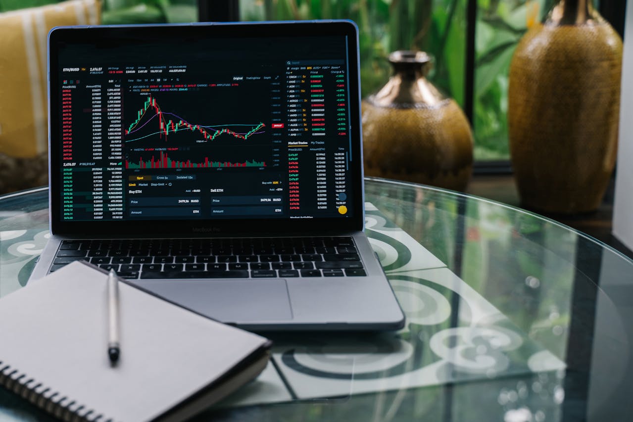 laptop with charts - Automated Crypto Trading Strategies
