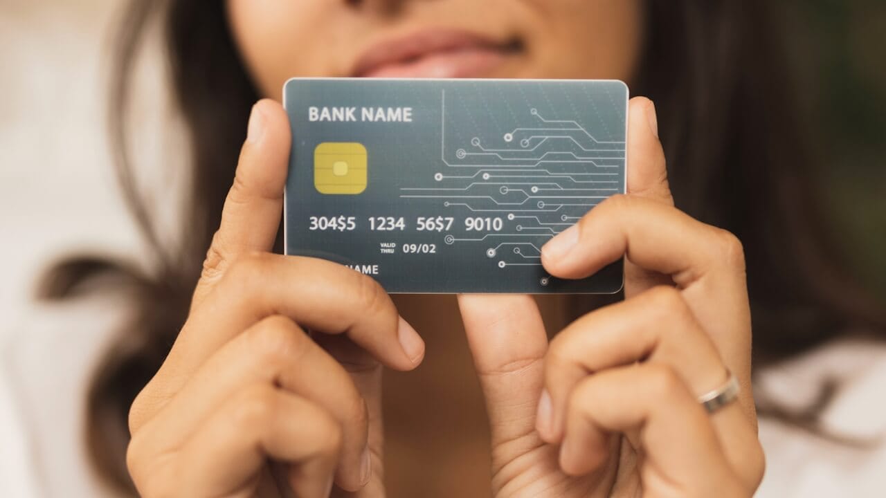 person holding a card - Best Crypto Credit Cards