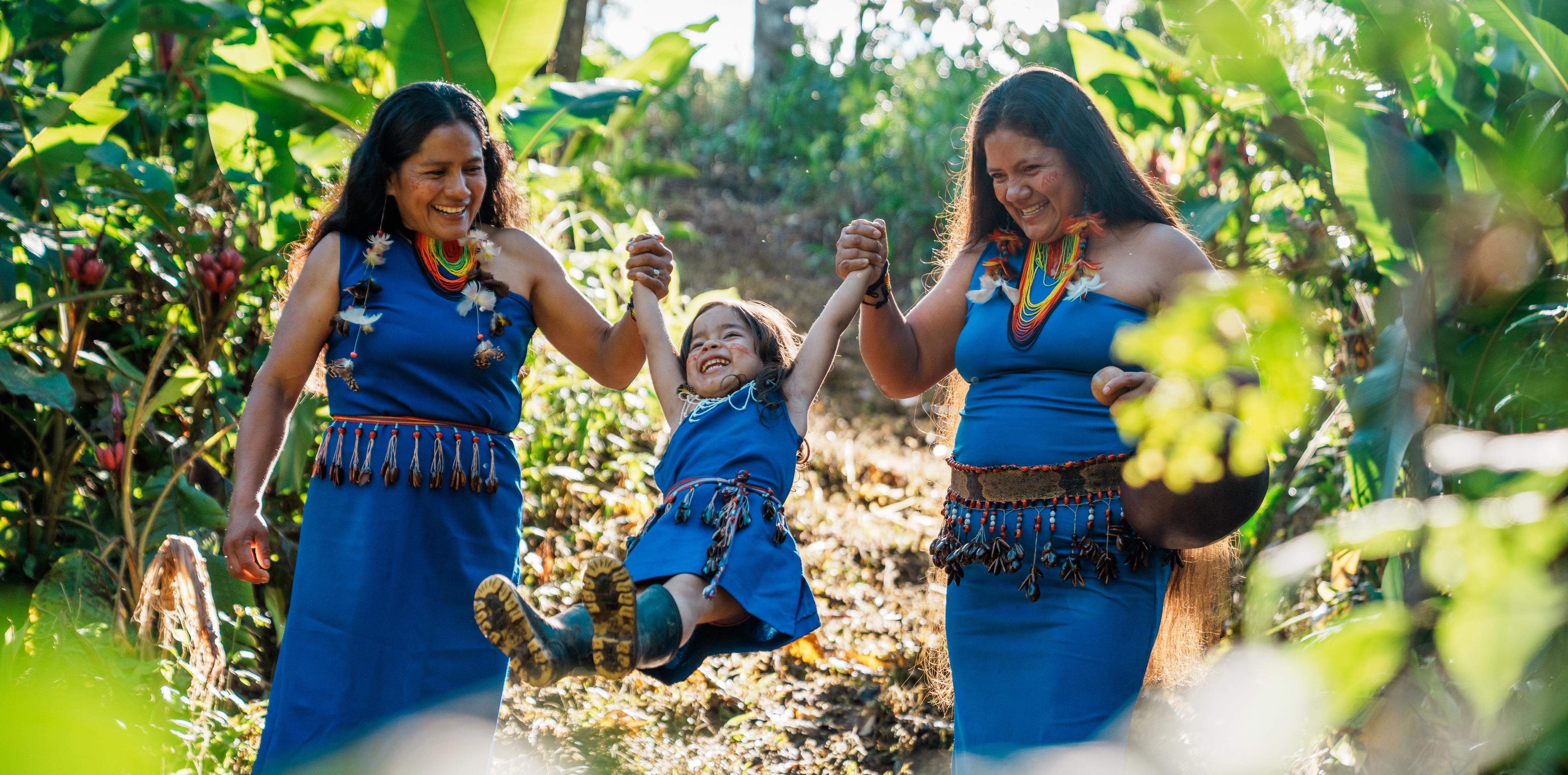 CAPTION: Andrea, Romina, and Liliana Kantash, members of the Chuwints Shuar community in the Ecuadorian Amazon, walk through the Palora-Pastaza conservation corridor — created by the Ecuadorian government in July, with support from Conservation International and partners.