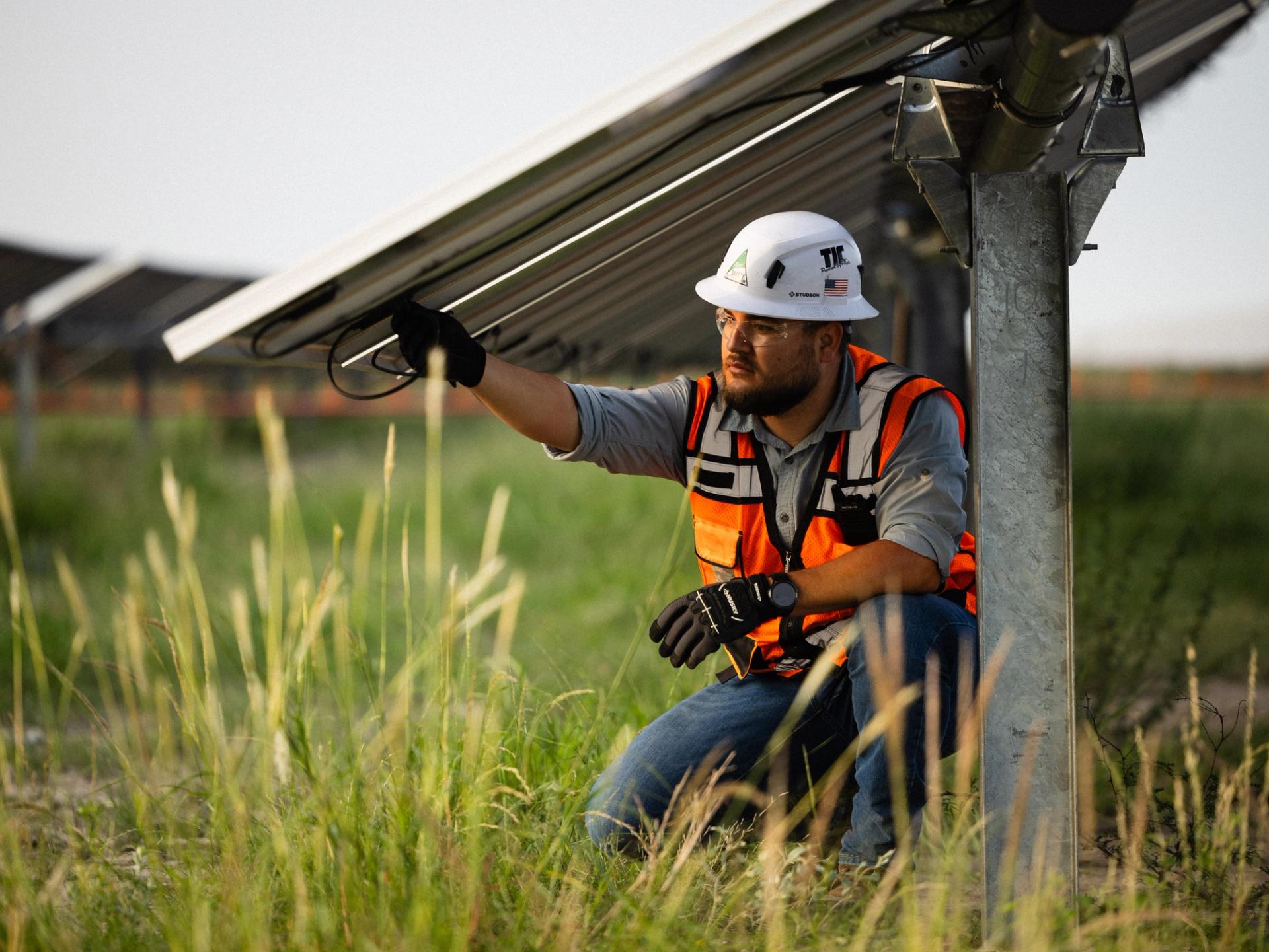 Solar construction crew working on underground trenching for a utility-scale solar field