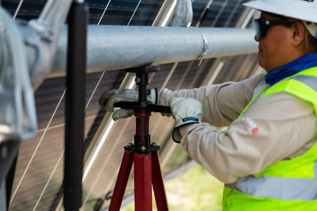 Power Ray crew setting and aligning a solar tracker