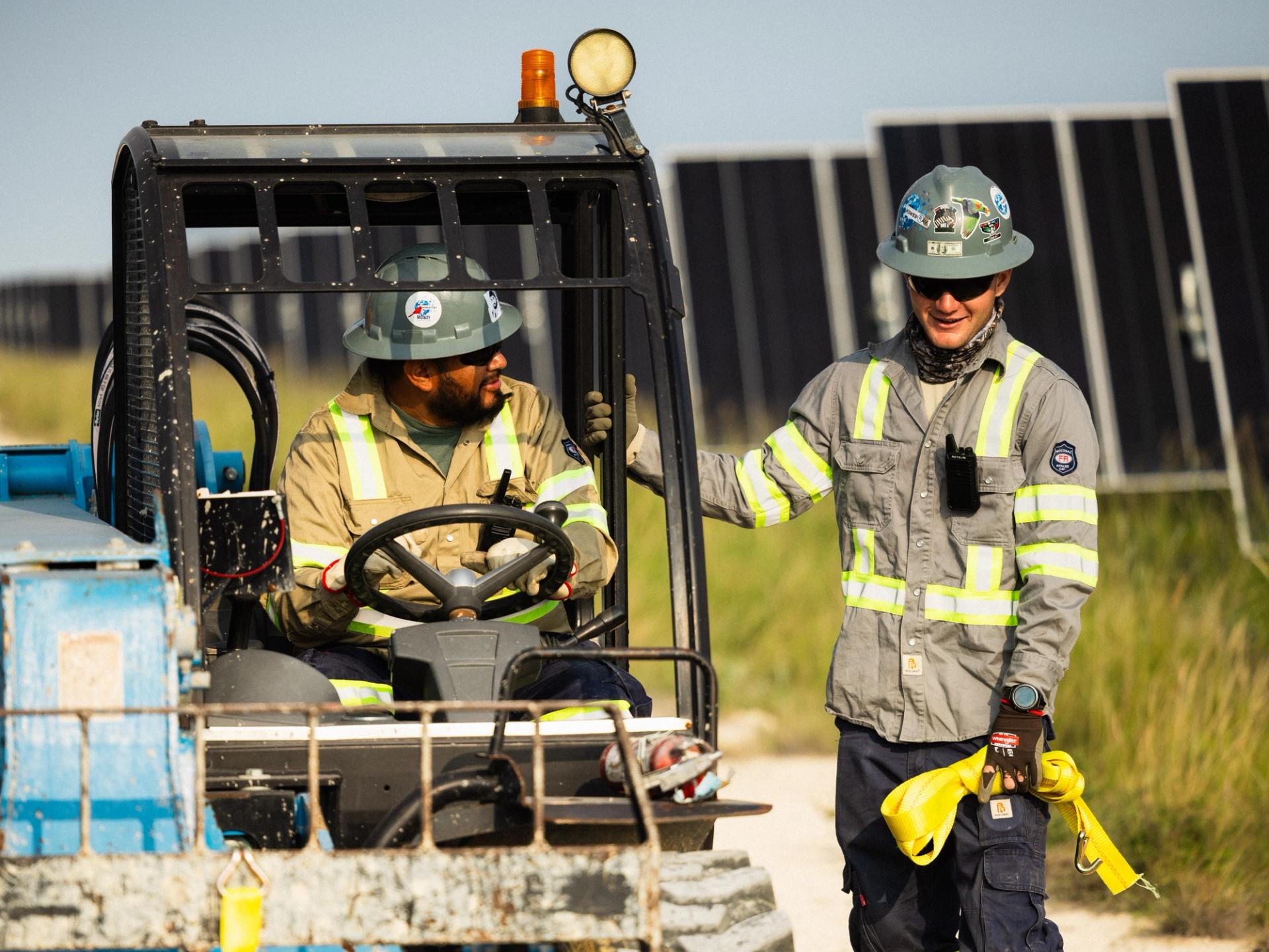Power Ray crew at sunset on a utility-scale solar project