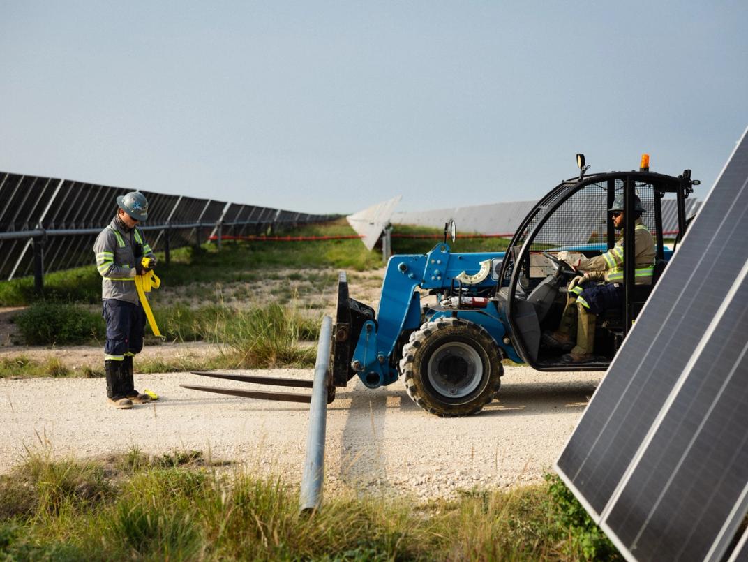 Solar construction at dusk on a utility-scale site