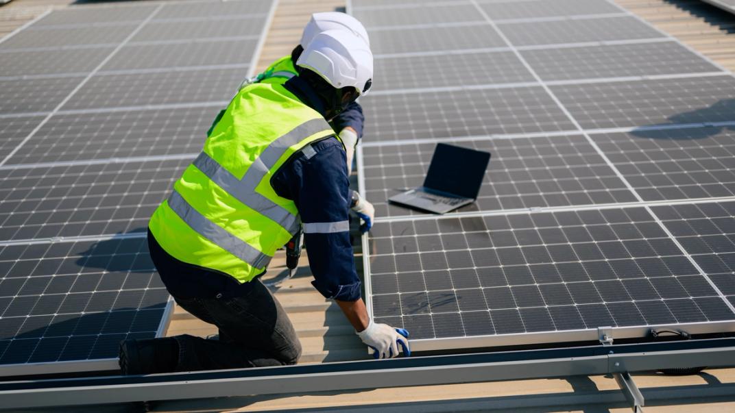 Solar maintenance worker on site