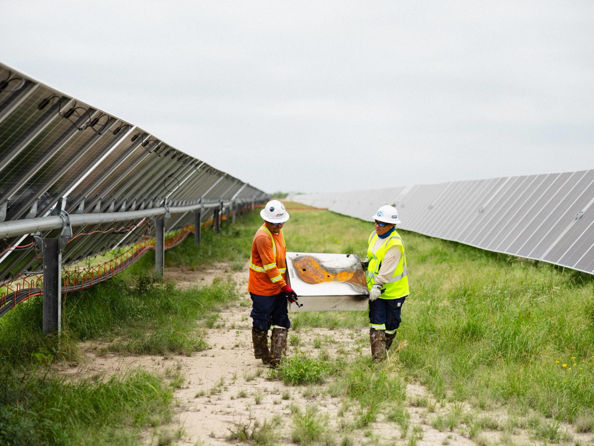 Power Ray electrical crew installing a solar inverter station