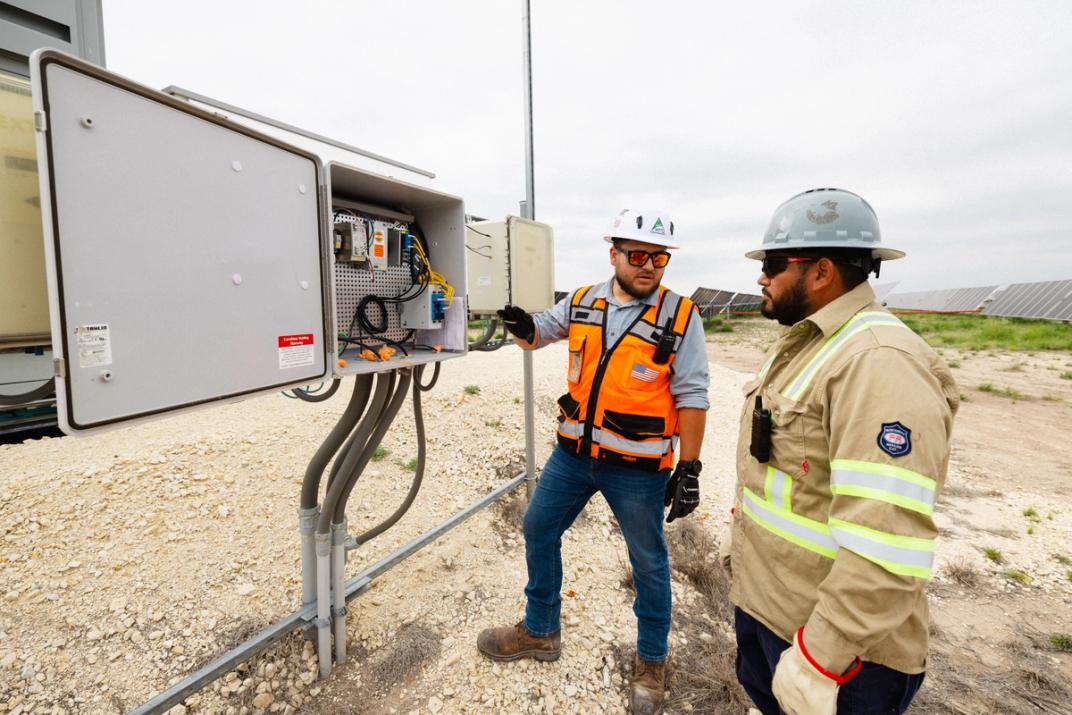 Power Ray crew setting and aligning a solar tracker