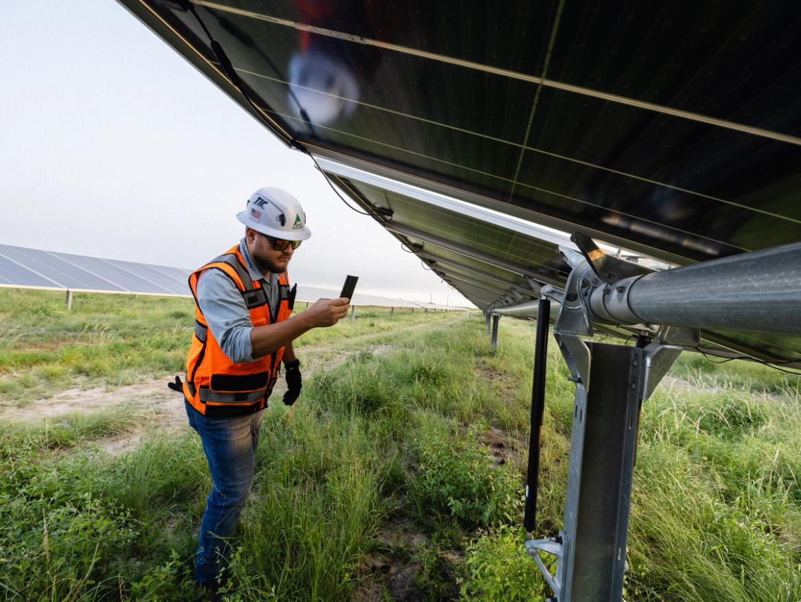 Power Ray crew meeting on a solar construction site