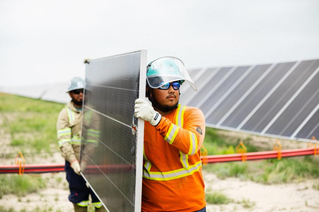 Solar workforce crew at sunset on a utility-scale project