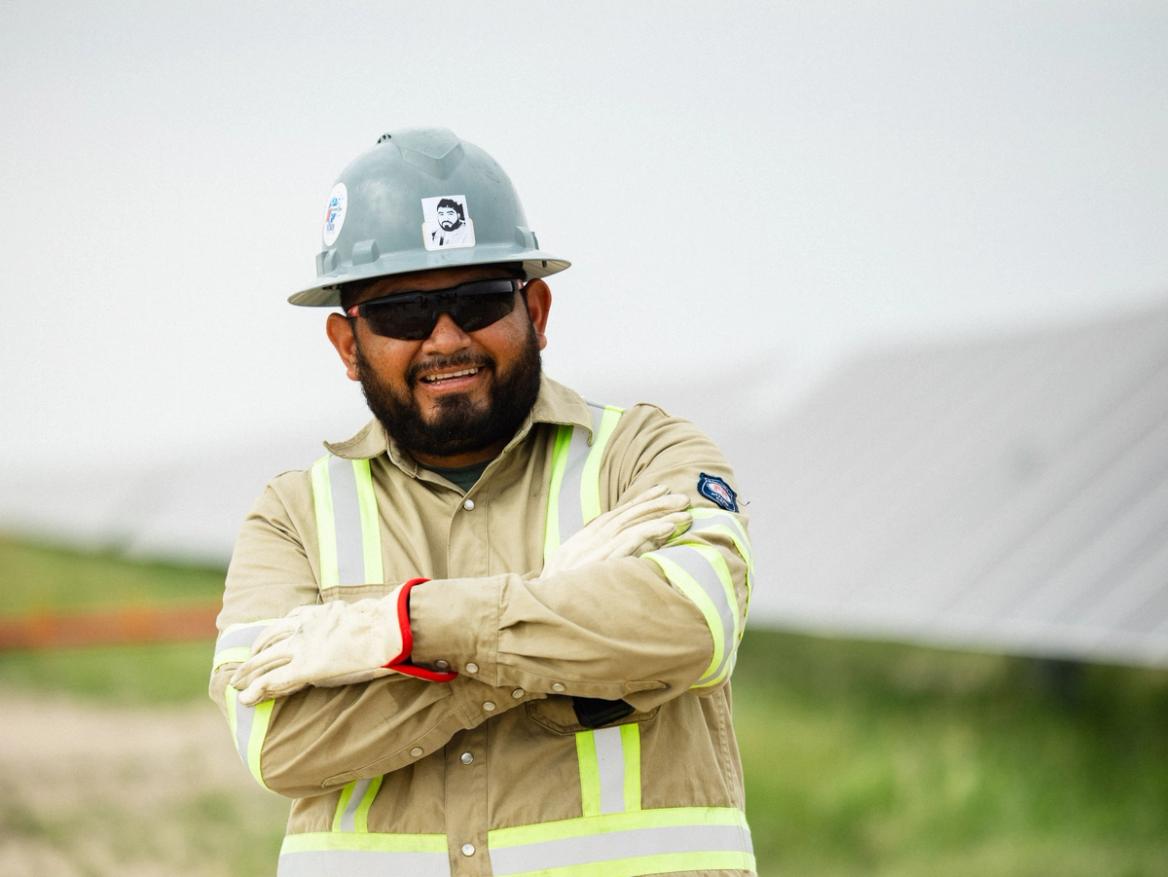 Solar crew member reviewing the trenching operation