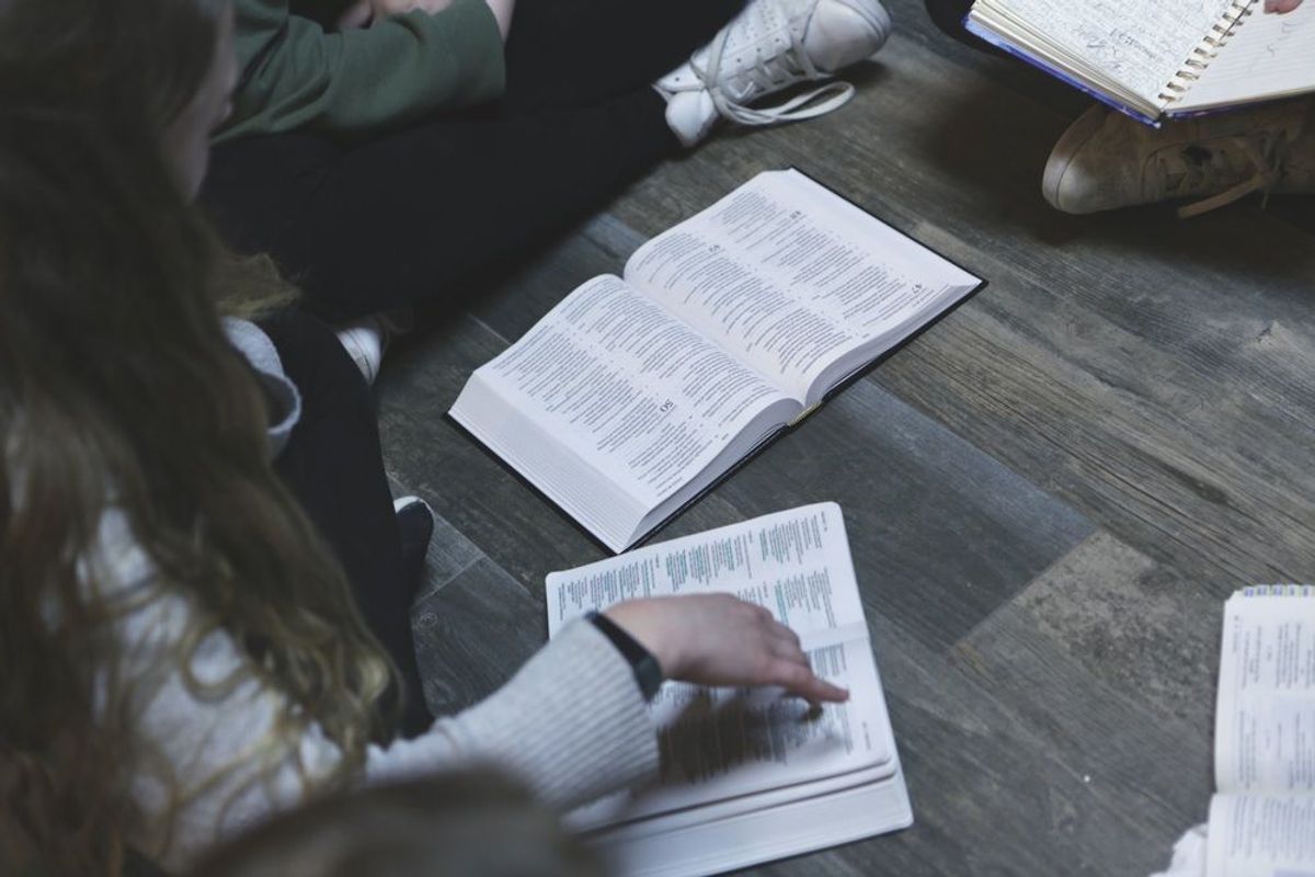 Open Bibles and journals during a study
