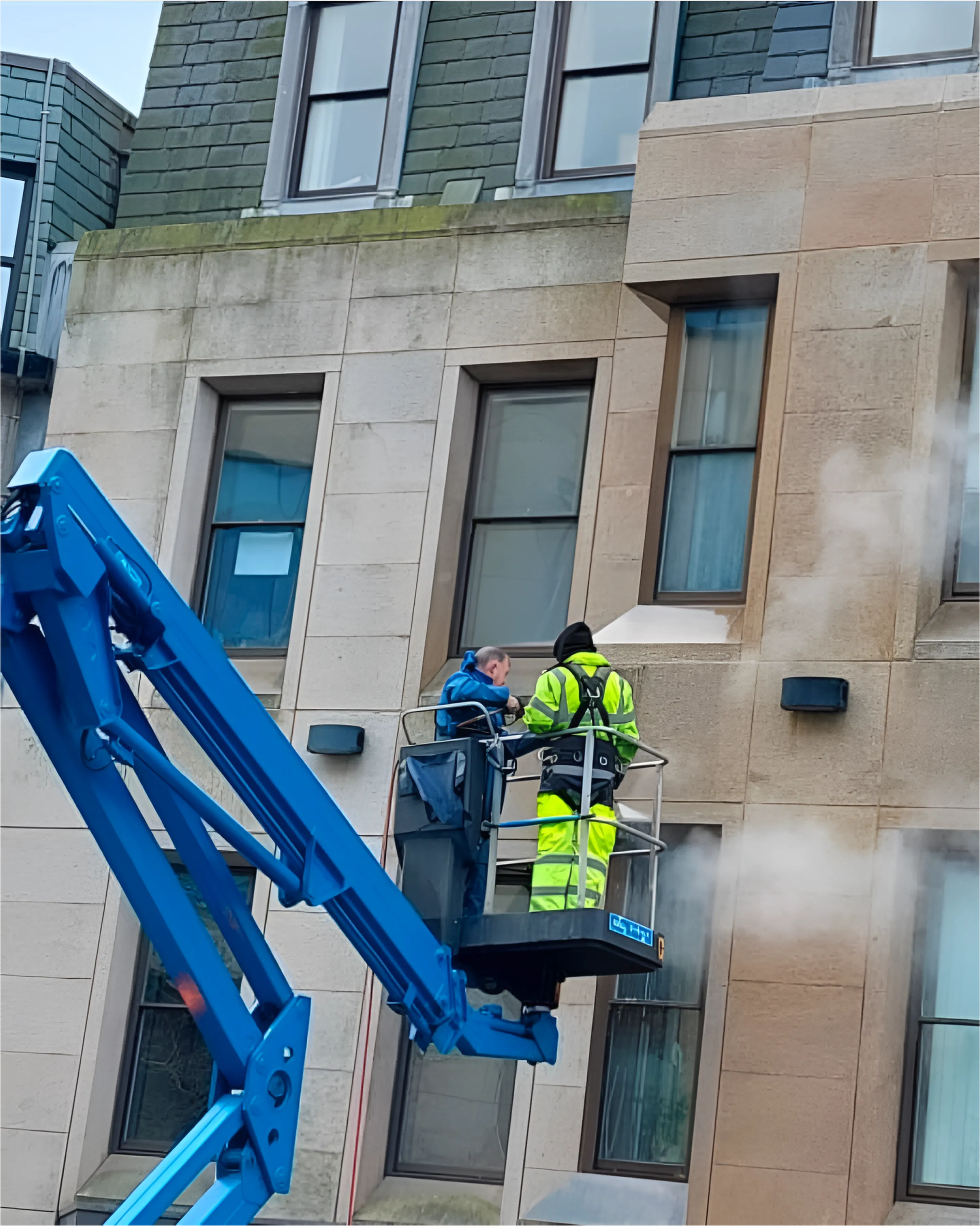 Softwash Solutions performing a job on a cherry picker