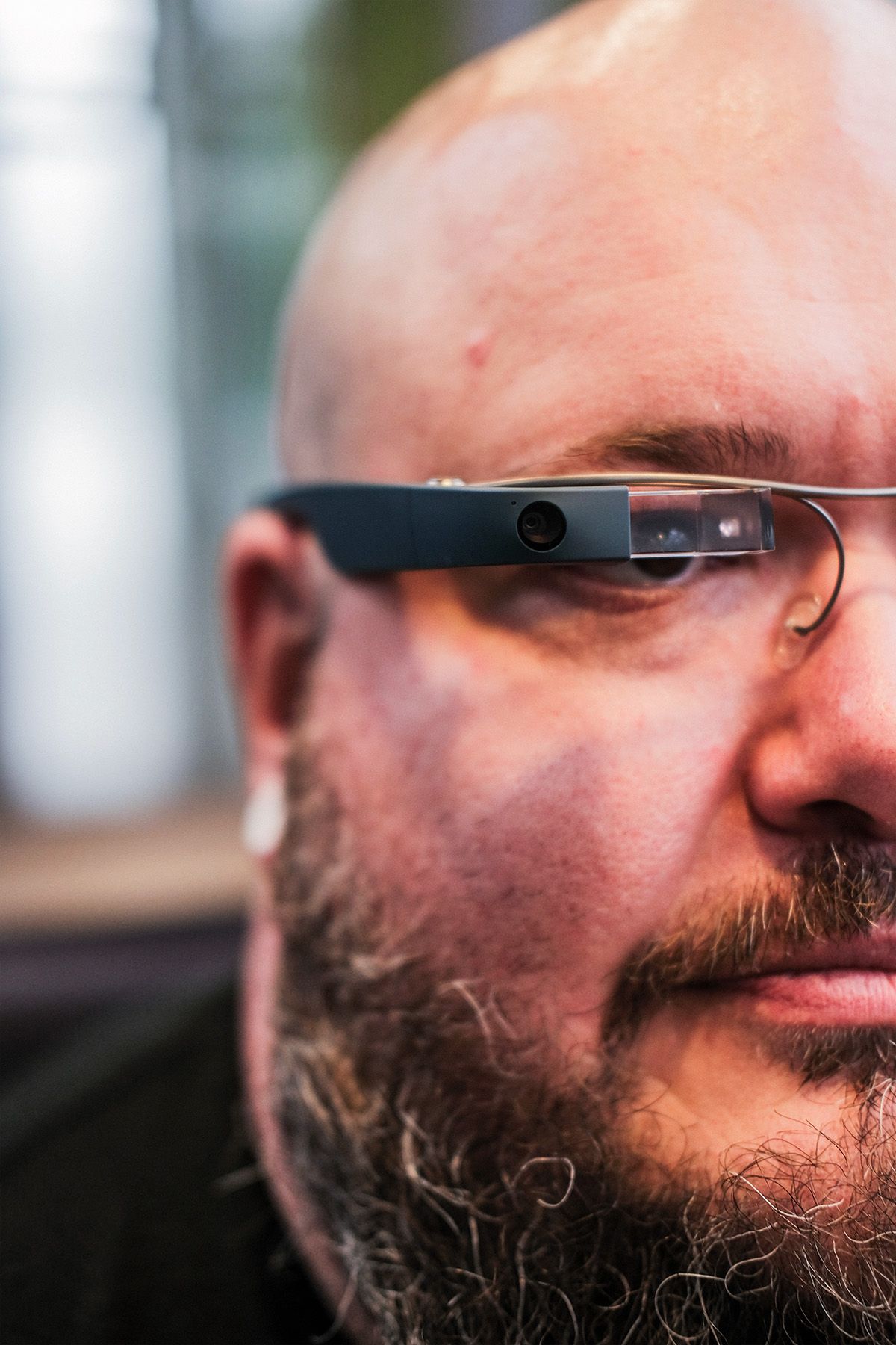 Close-up of munevo drive user's face showing details of the smartglasses