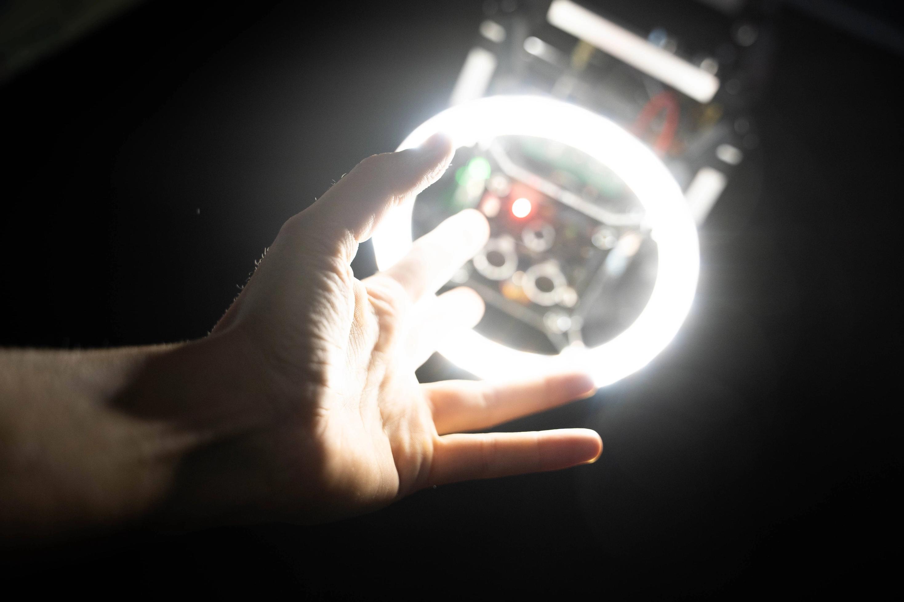 Hand reaching into a light