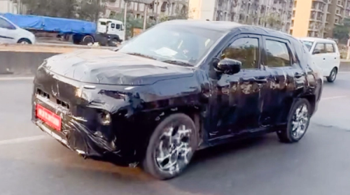 Maruti Suzuki’s Mysterious New SUV Spied: Is It a Grand Vitara Facelift or a Stretch-Limo 7-Seater?