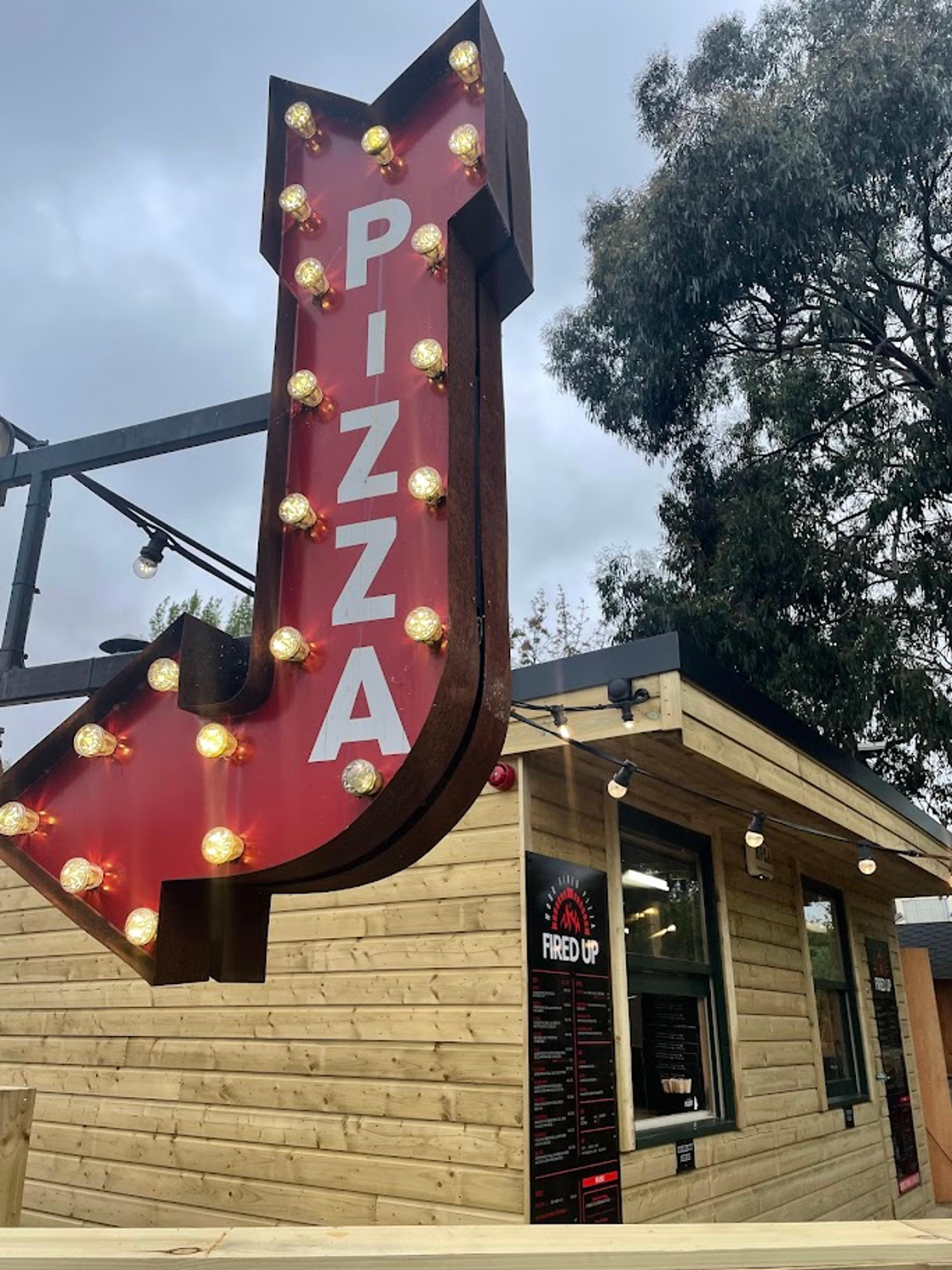 The Fired Up Pizza sign and building at The Old Orchard, Rathfarnham