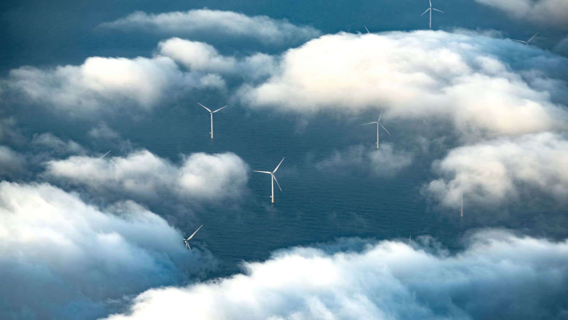 aerial-wind-turbines-clouds-sea