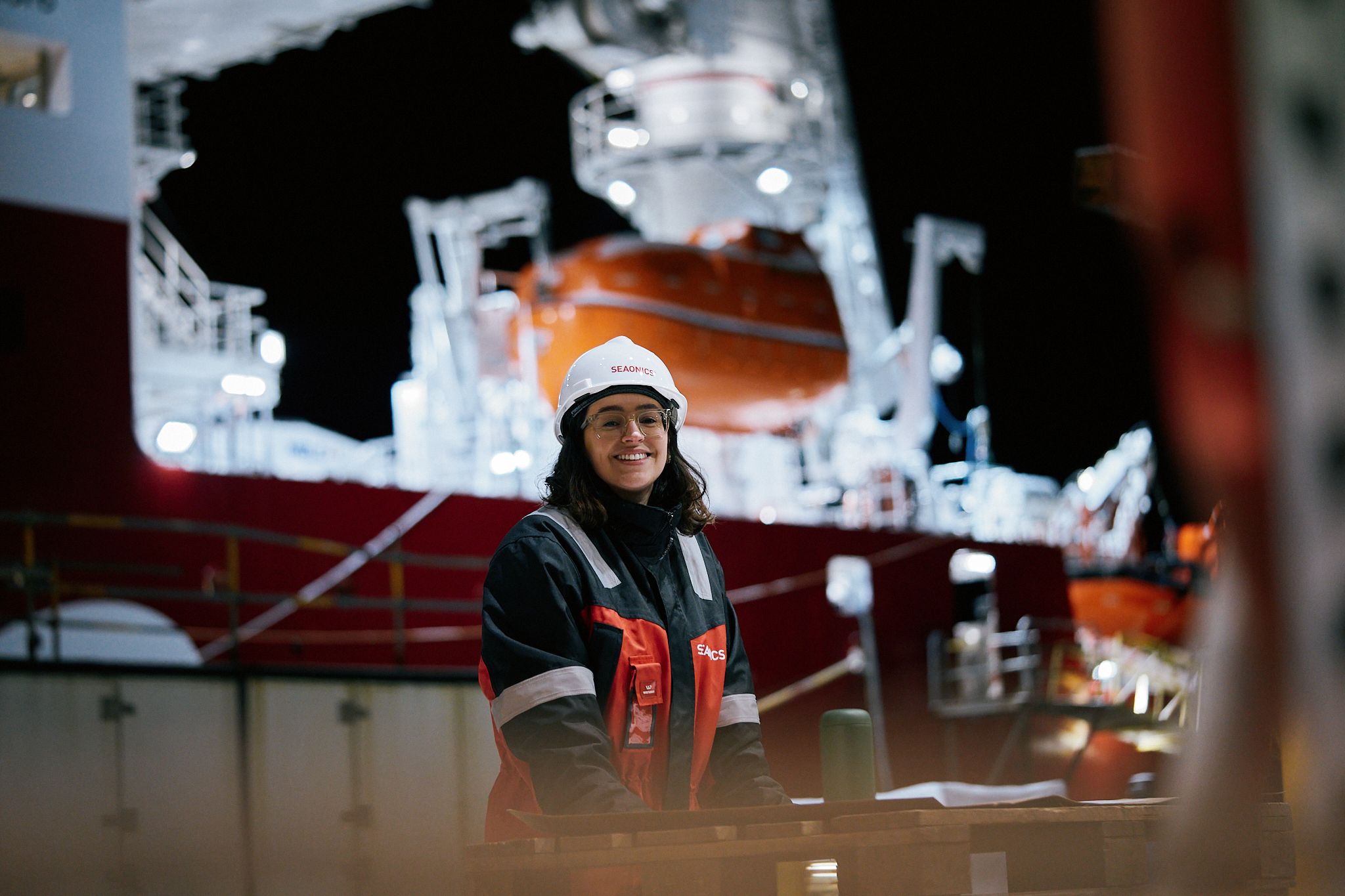 Woman in front of a vessel