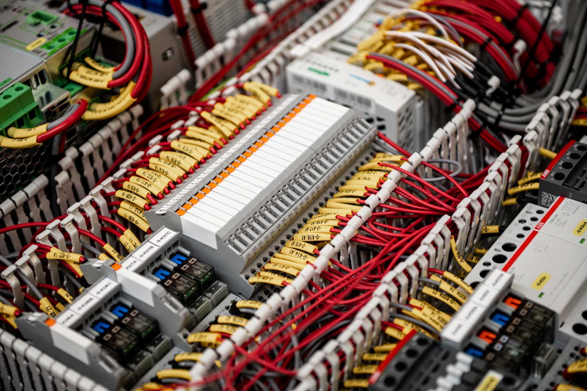 Custom marine electrical cabinets and drive systems in a workshop environment