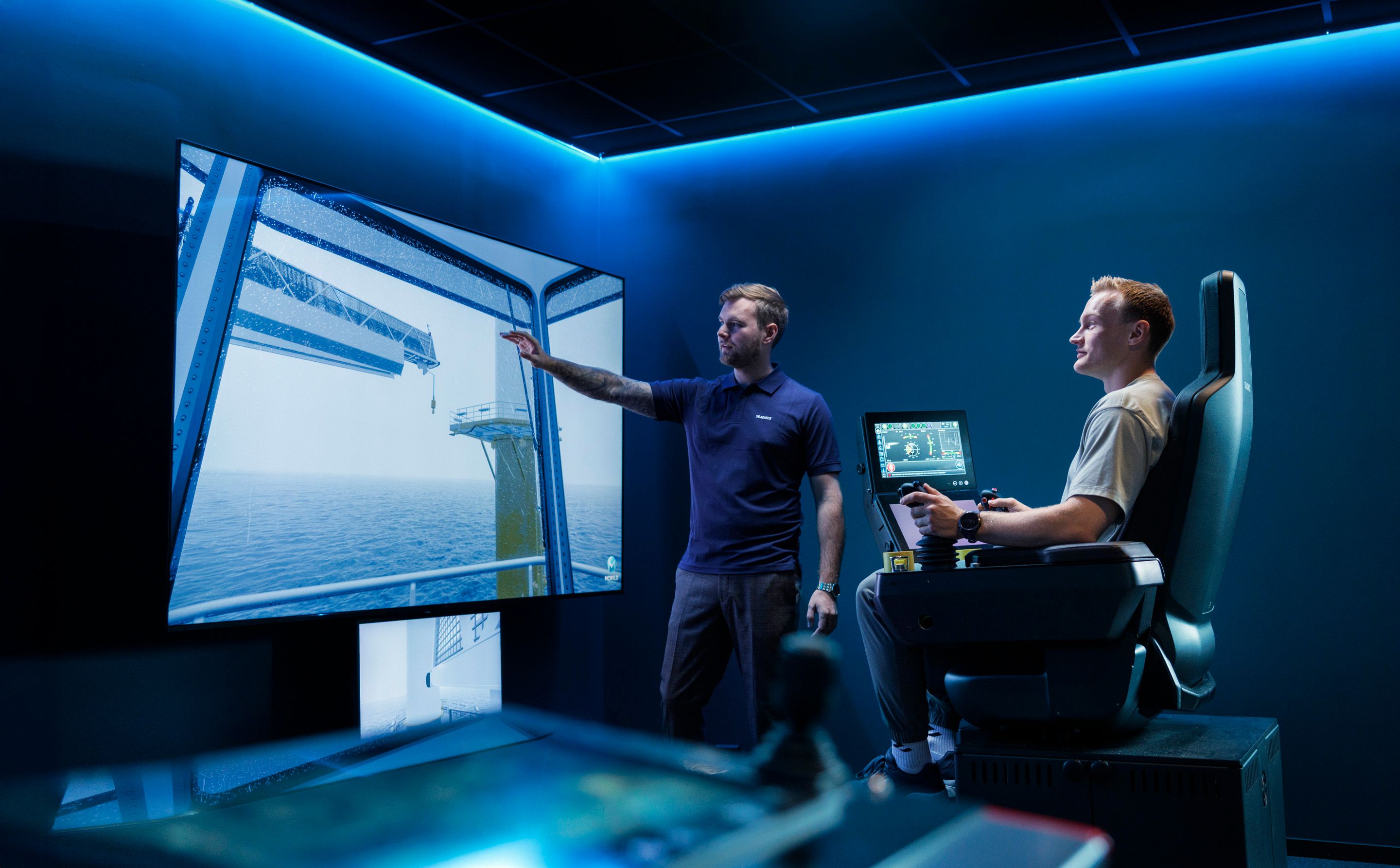 Crane and gangway simulators with digital twin environments used for operator training