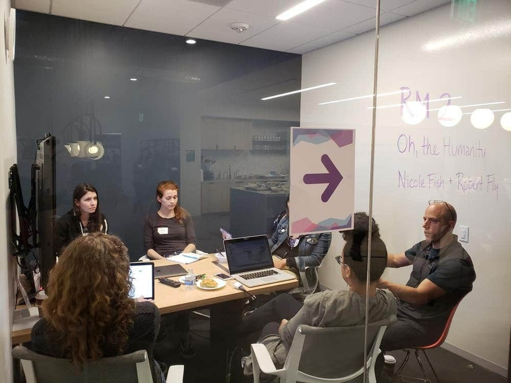 Five people have a small group discussion during Day of Shecurity