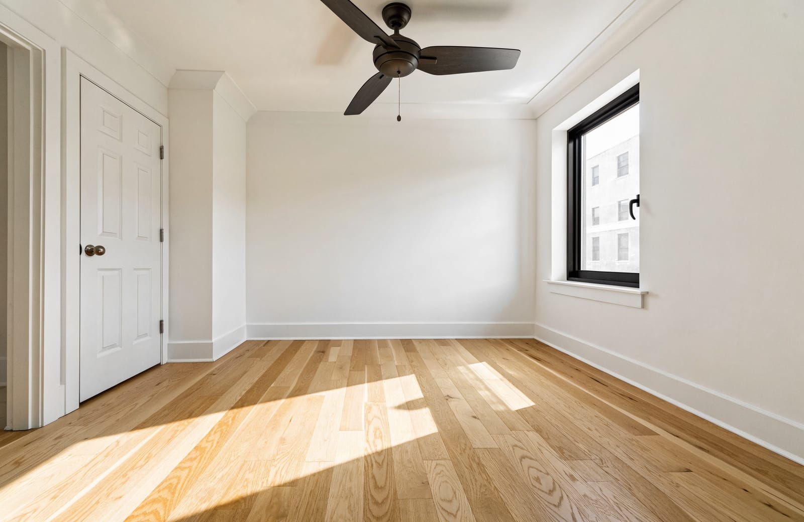 A freshly renovated, empty bedroom