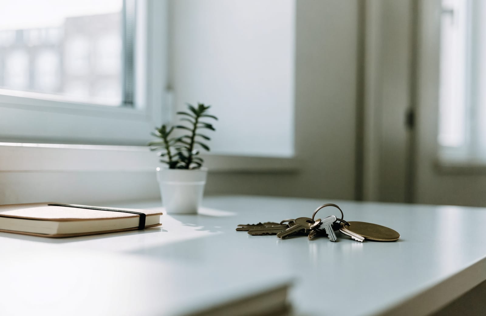 Property keys on numbered tags on a bright desk