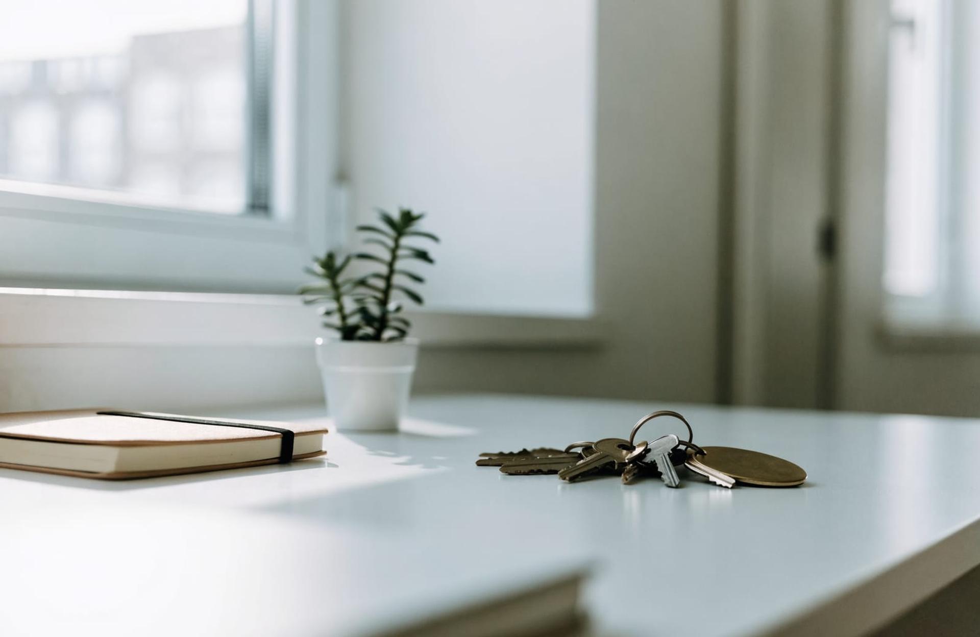 Property keys on numbered tags on a bright desk