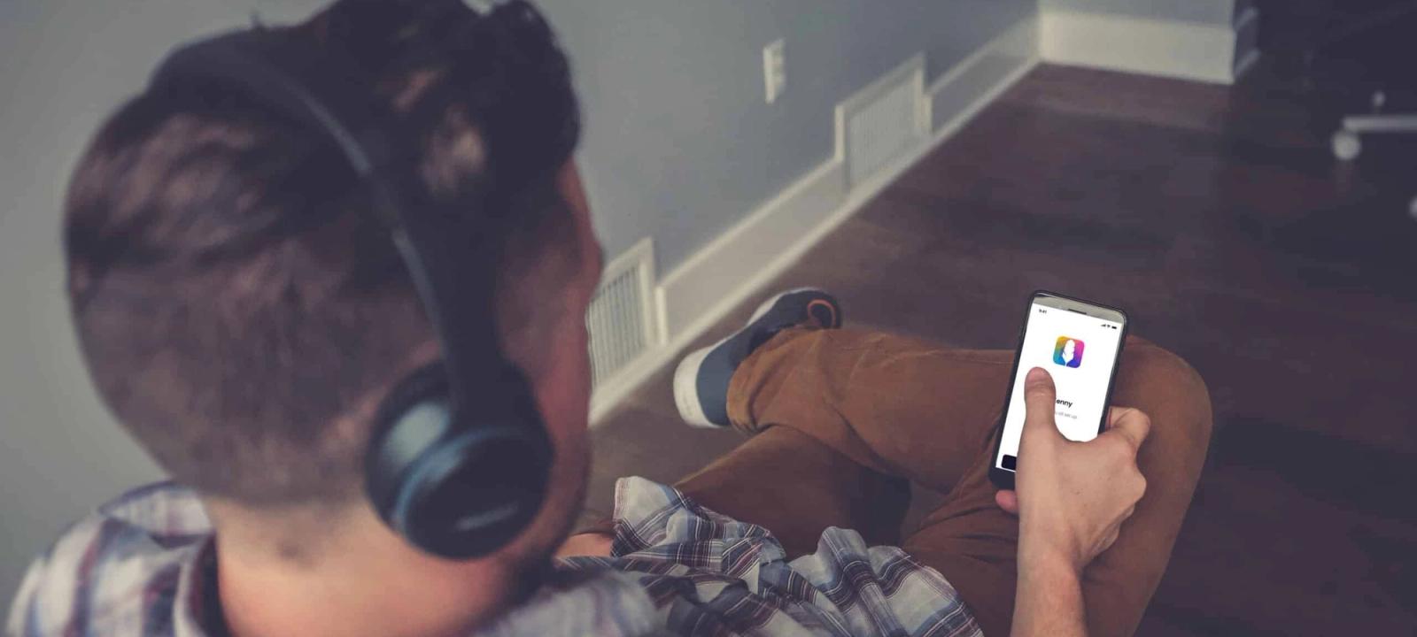 Man using smartphone with Quilia app, illustrating transparency in personal injury case management