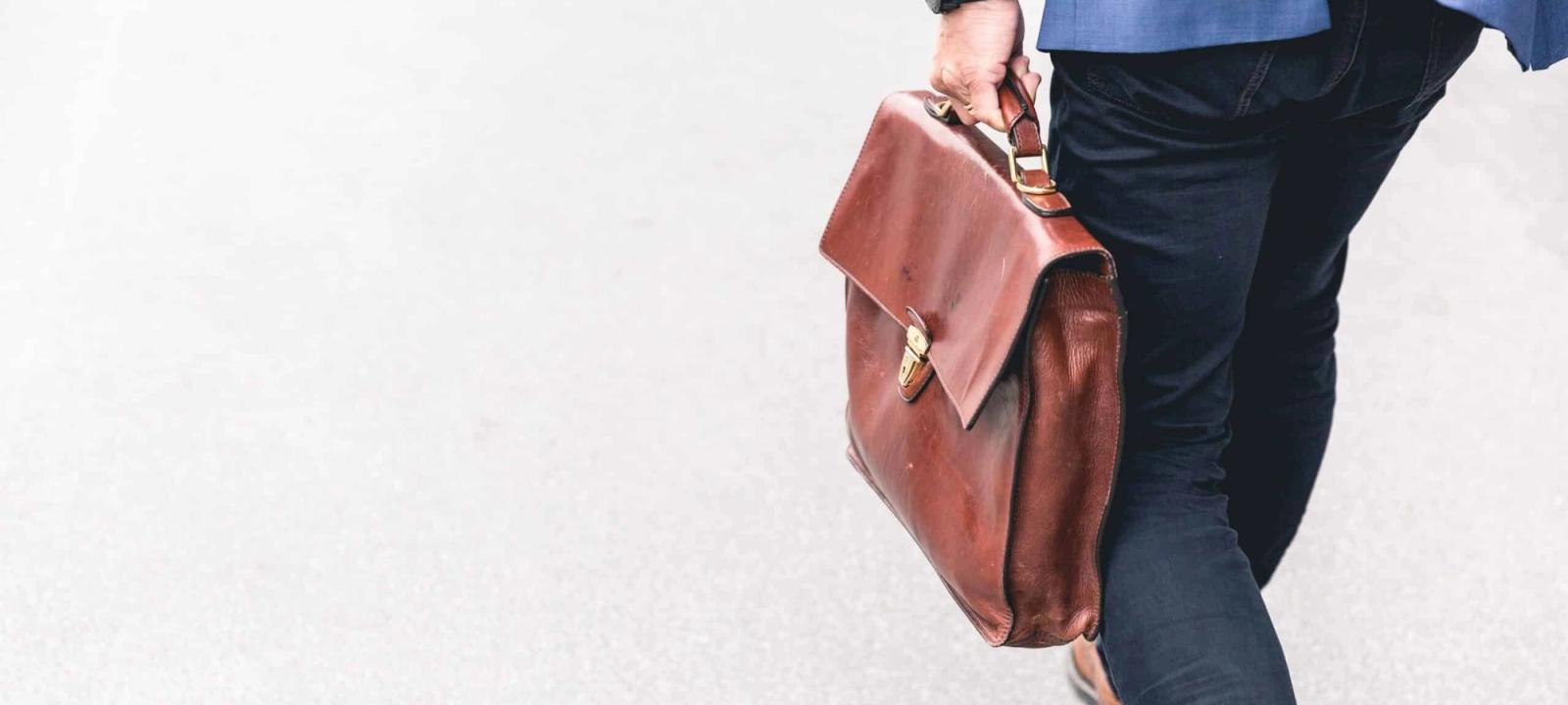 Attorney walking with a briefcase, symbolizing trust and effective personal injury case management