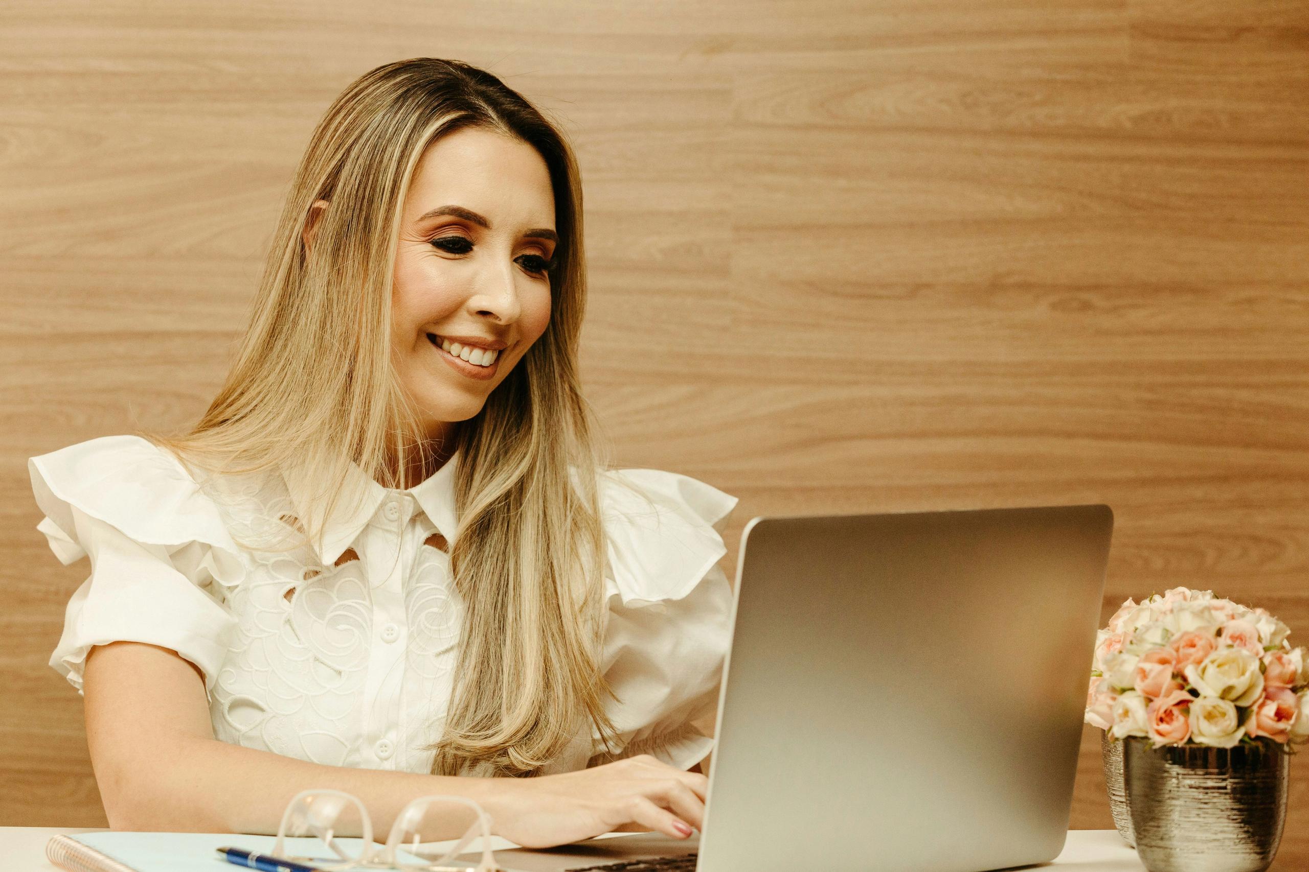 Personal Injury Case Manager at Work on Laptop Personal injury case manager using laptop to manage client updates and treatment plans