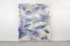 An untitled artwork by Juliana dos Santos from 2026. A square piece of fabric featuring pale shades of blue and white that blend into one another as well as blue-speckled hues.